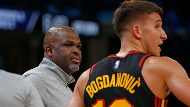 Nate McMillan speaks with Bogdan Bogdanovic.